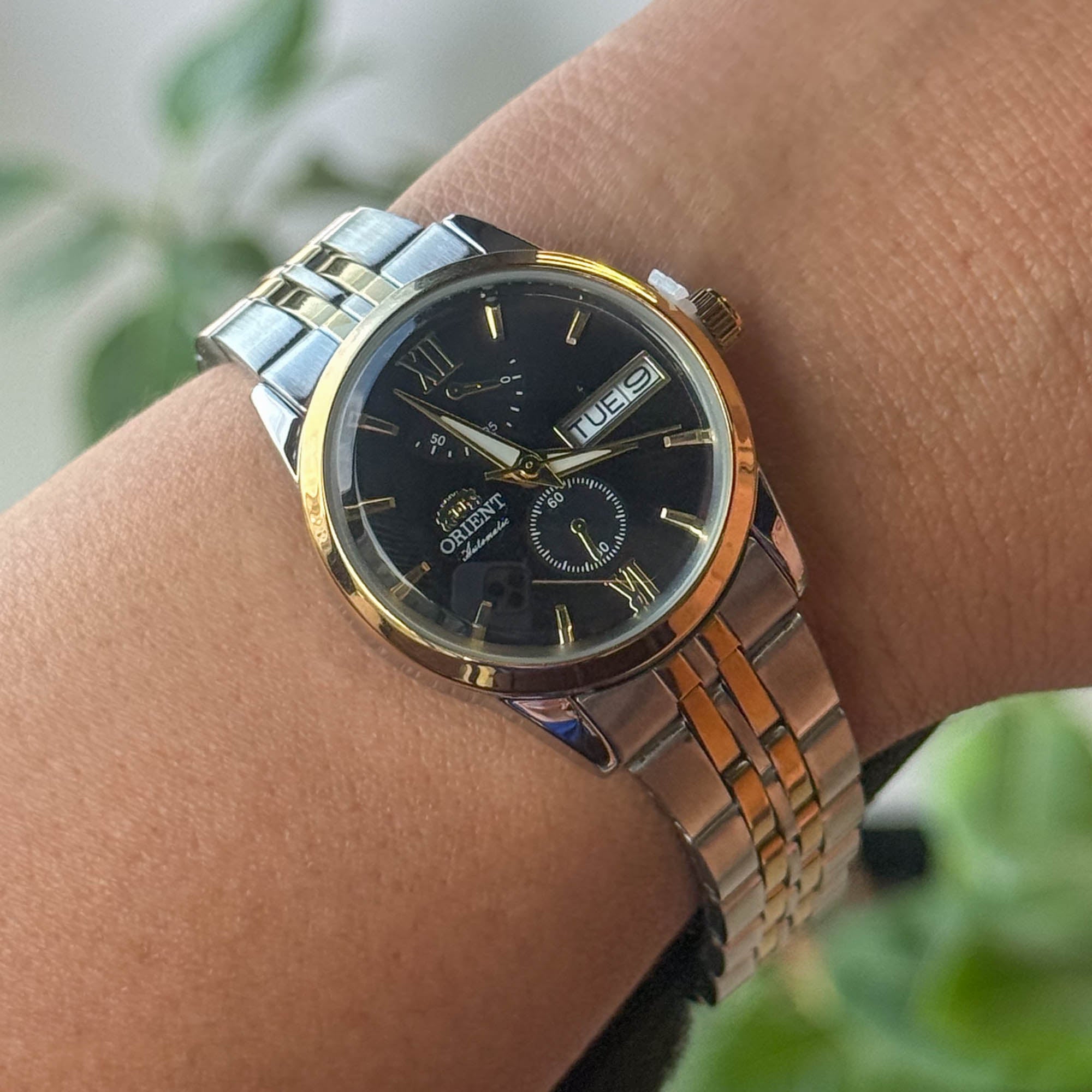RELOJ 0R1ENT BICOLOR FONDO NEGRO  DAMA