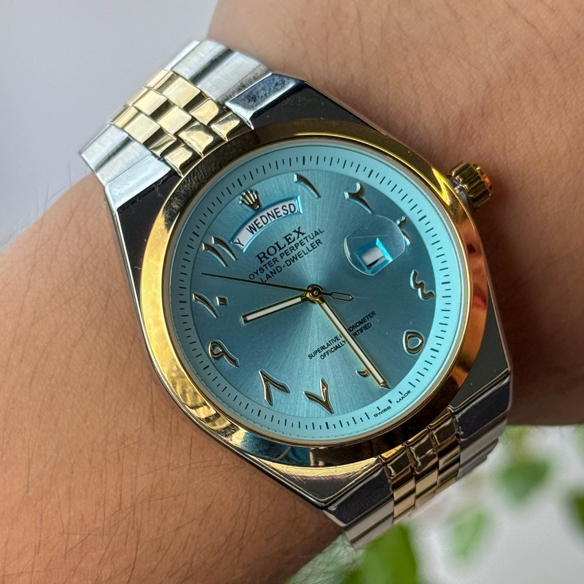 RELOJ R0L3X BICOLOR FONDO CELESTE  HOMBRE